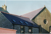 The picture to the right shows the slate hanging that can be seen from the road